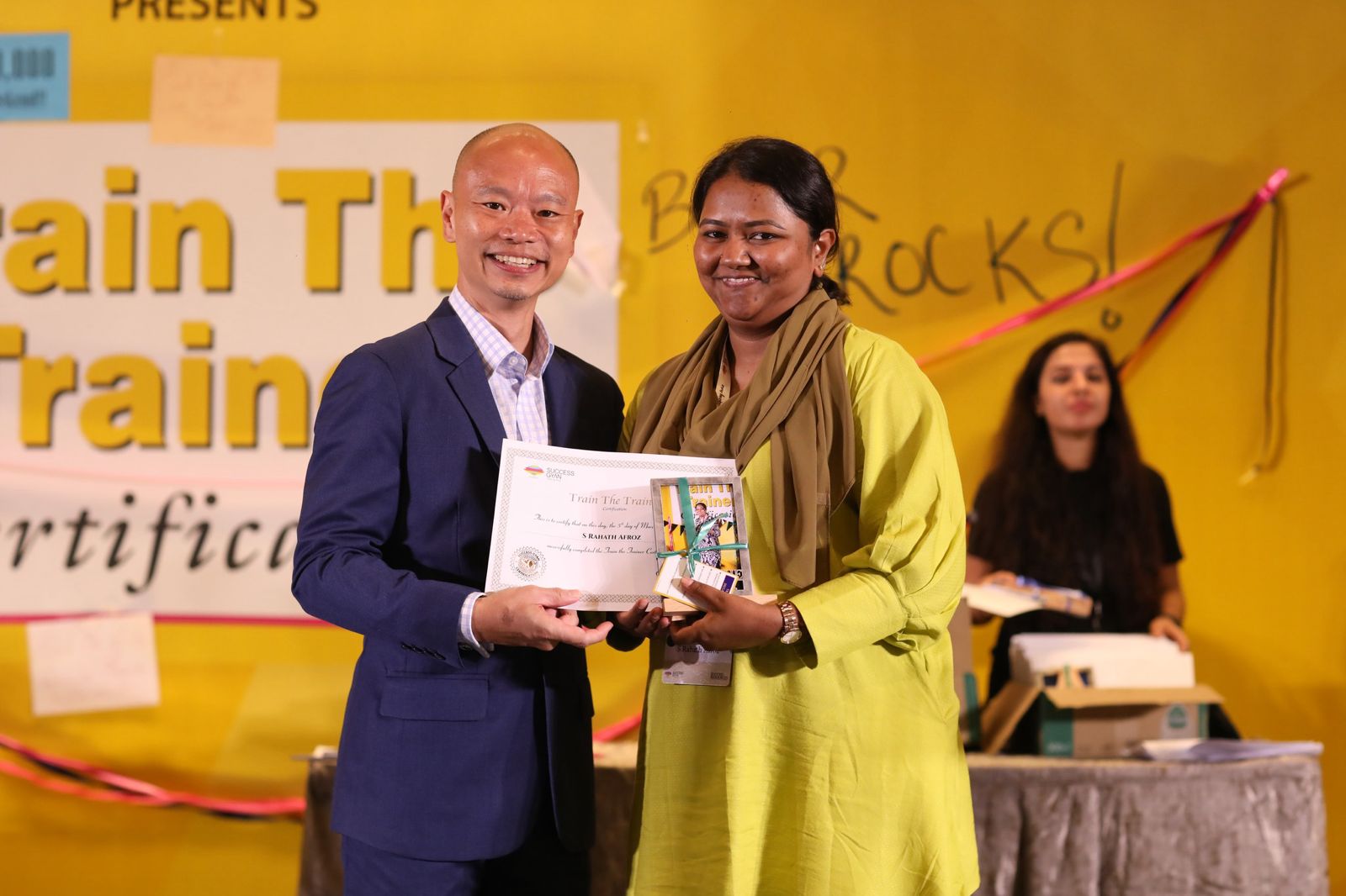Rahath Afroz receiving her Train The Trainer certificate